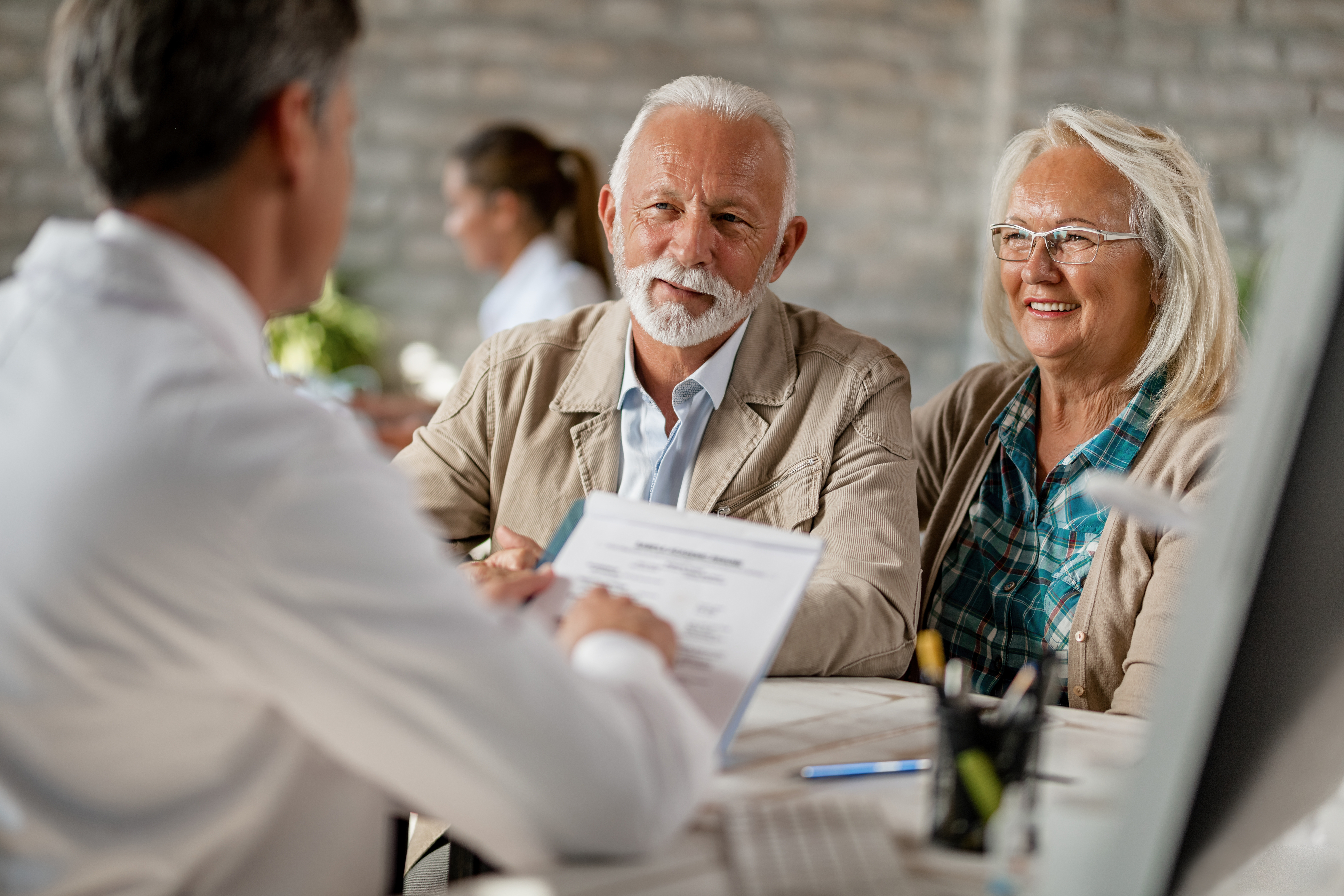 Clients meeting with an insurance advisor